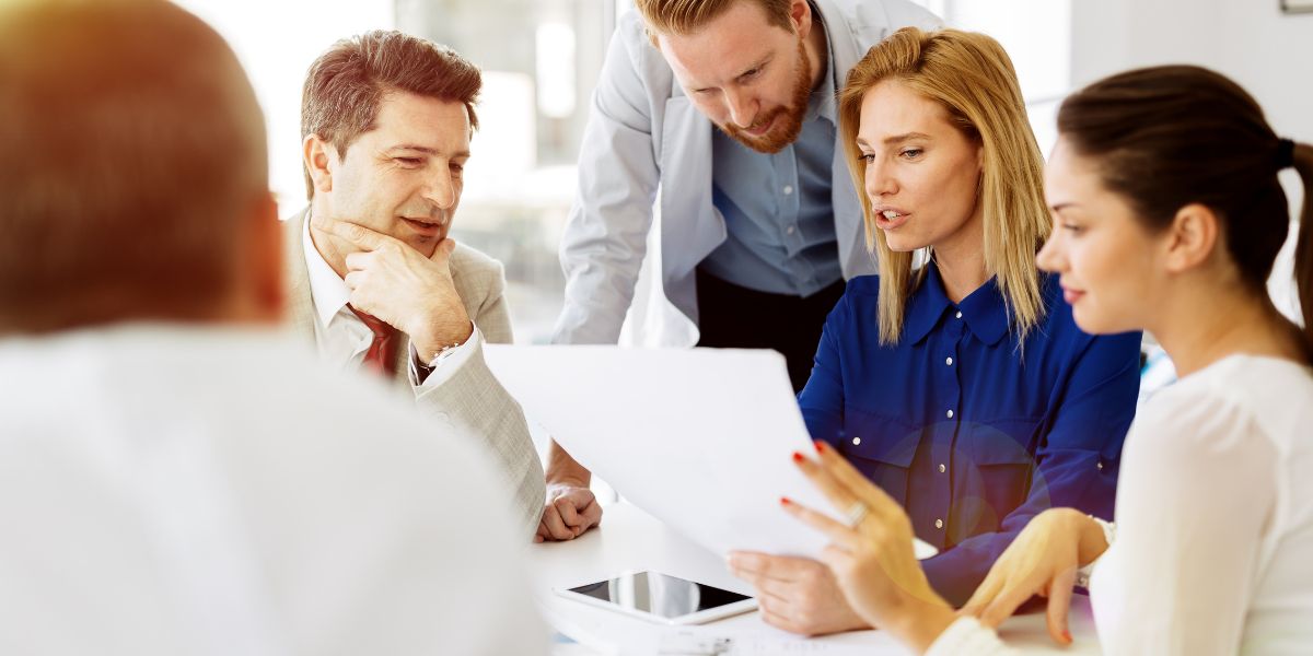 employees discussing strategy at the office