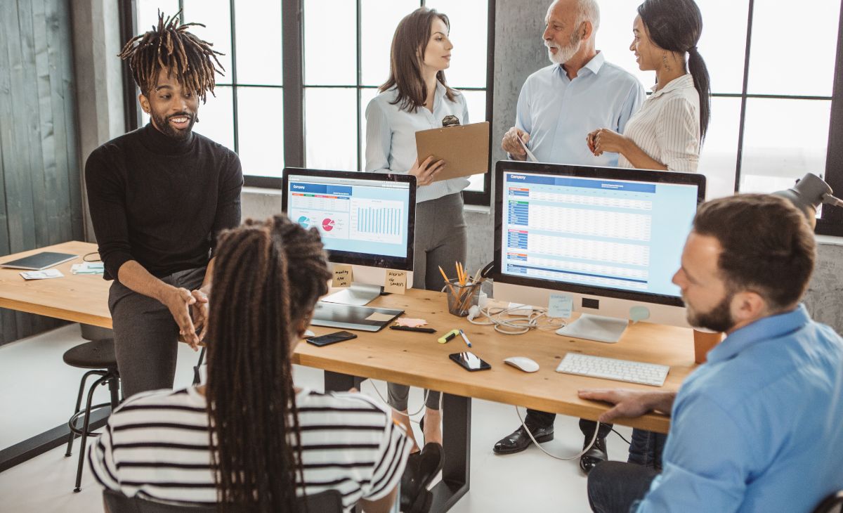 employees discussing work done