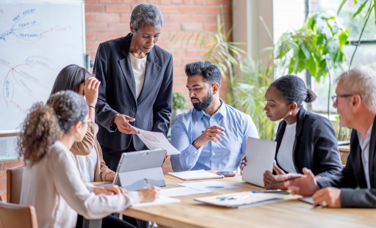 employees discussing the strategy at the office