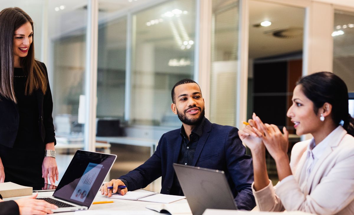 employees discussing strategy and results