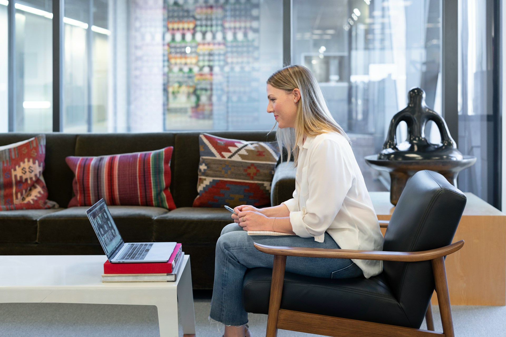 A businesswoman working in an office on a virtual call