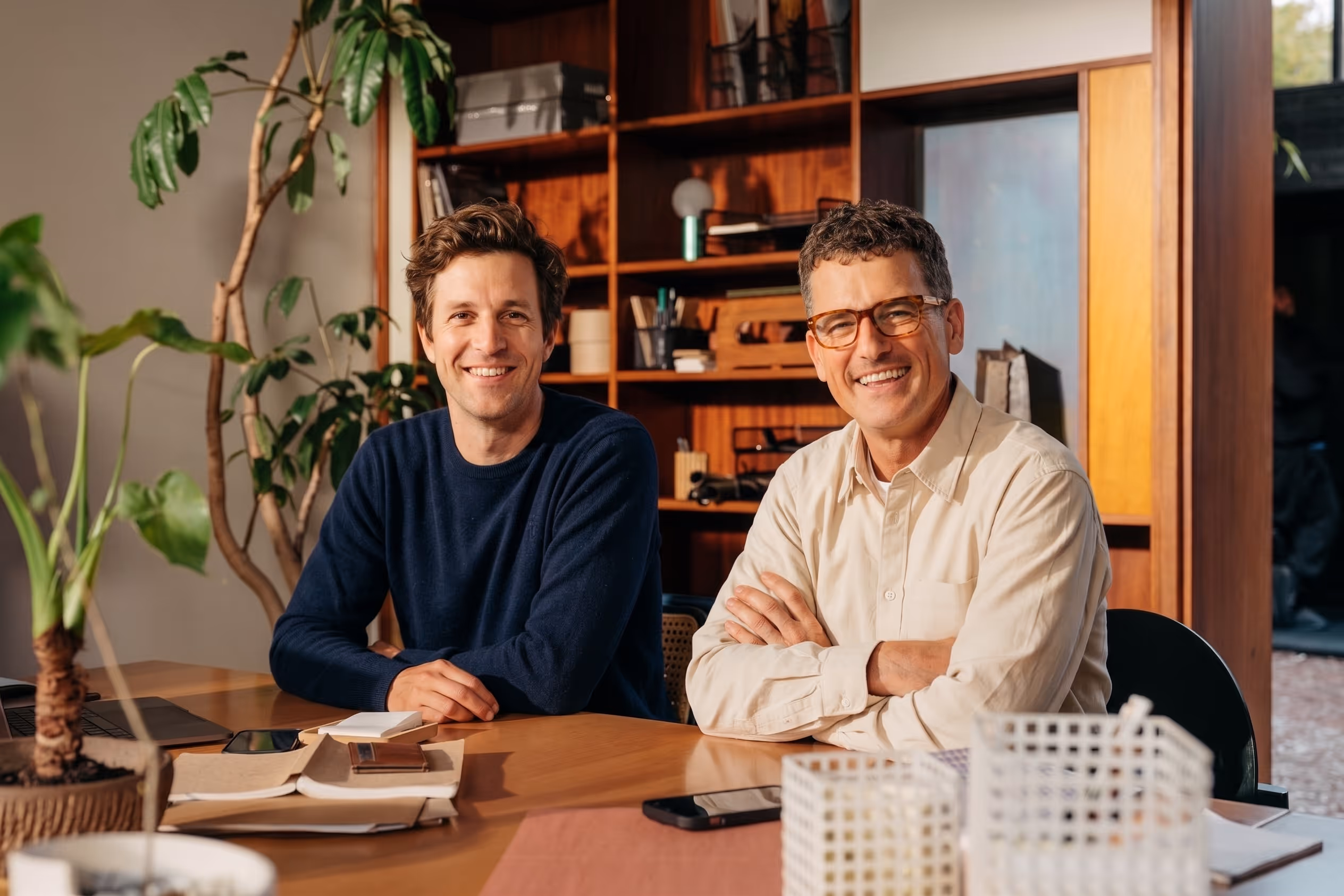Two Leads at Scale team members at a desk
