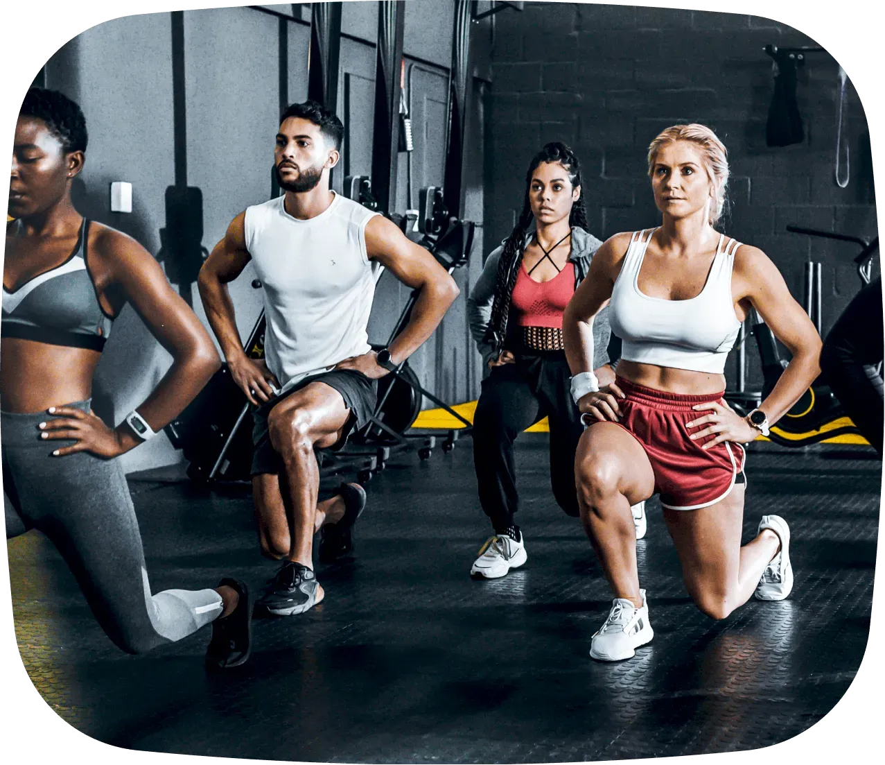 A group of people working out in a gym.
