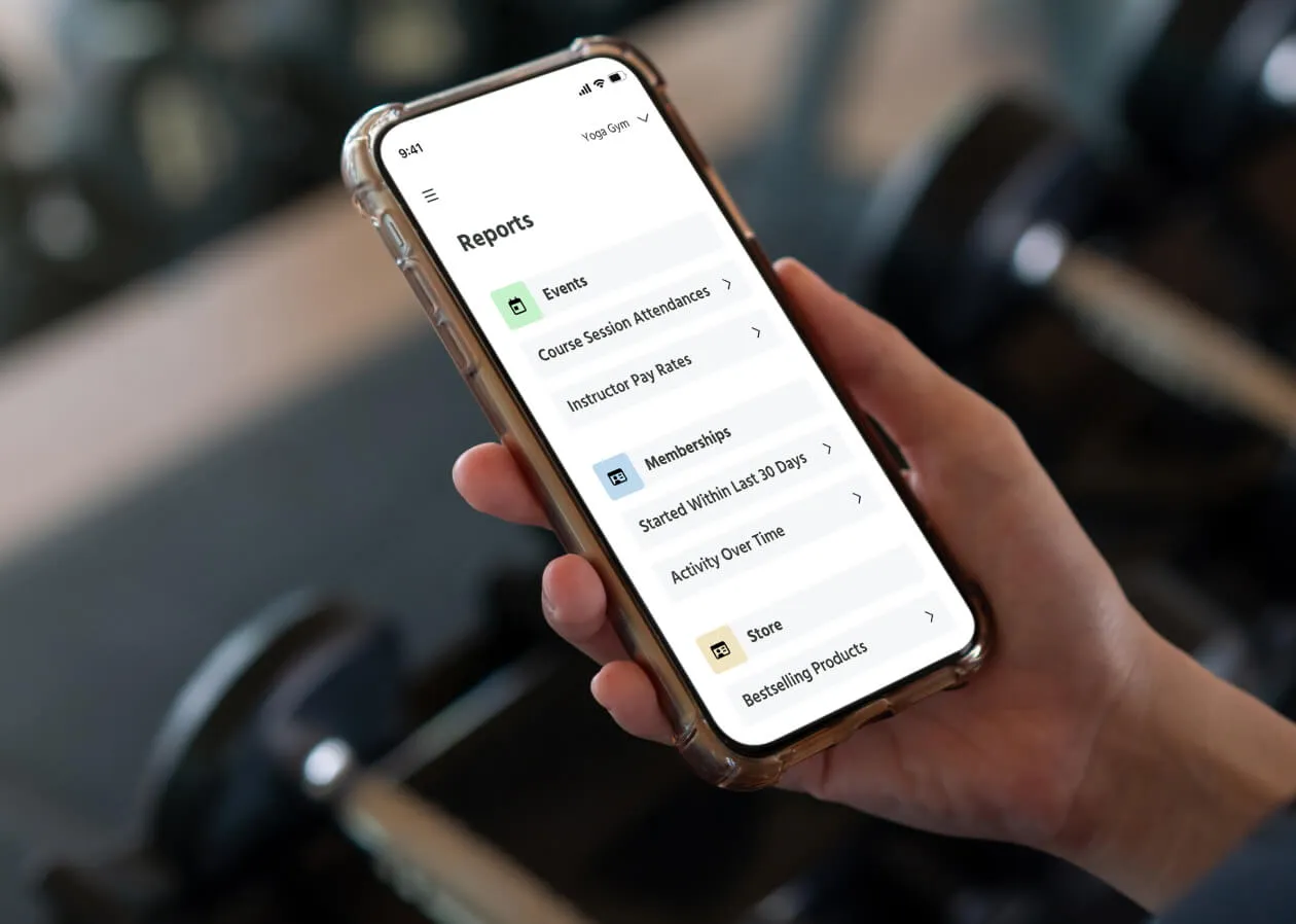 A TeamUp customer checking their reports from their phone