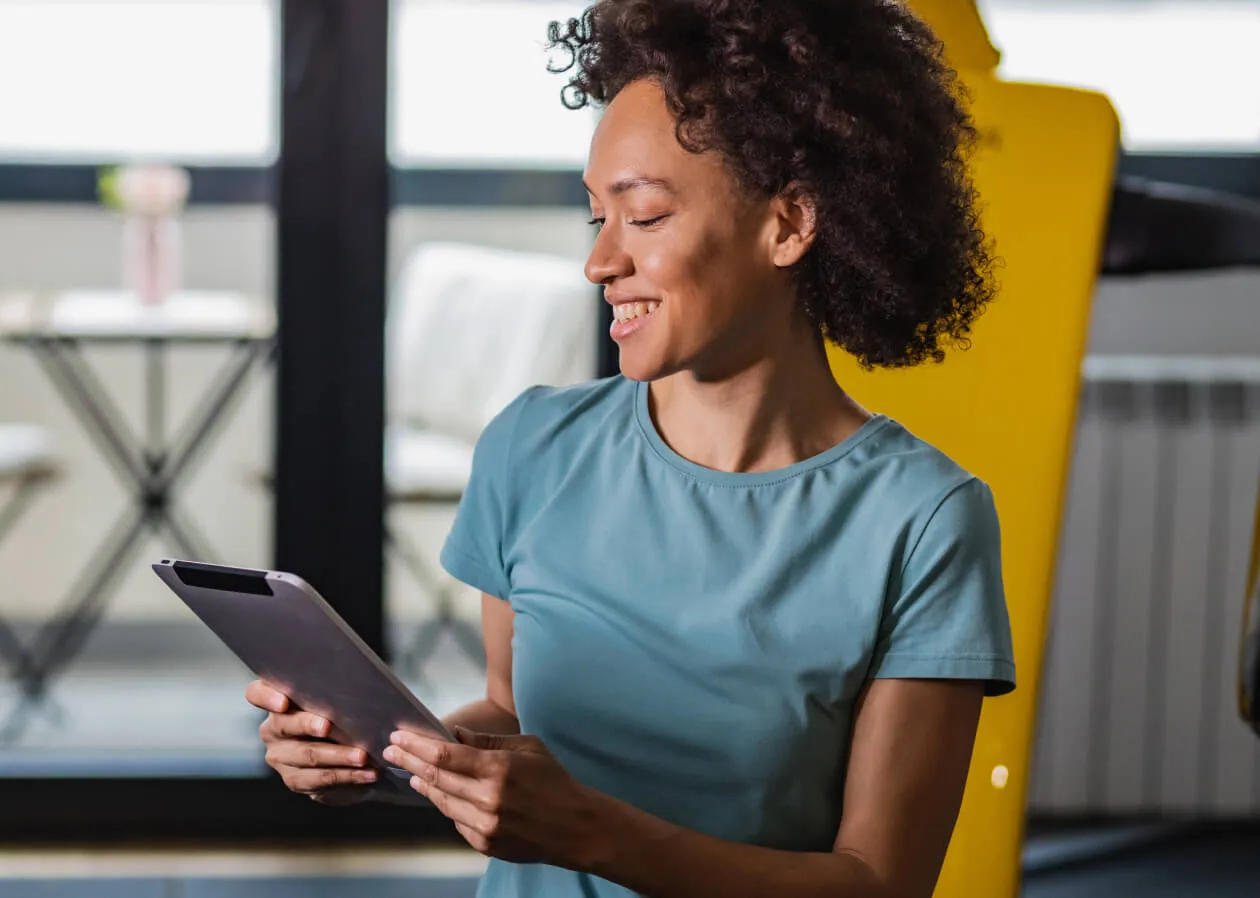 A TeamUp customer checking their AI Business Advisor report from their tablet device