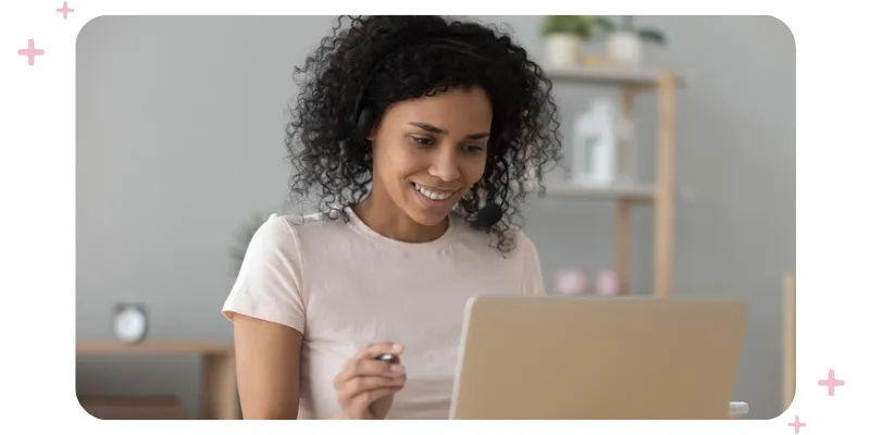 Woman sitting in front of a laptop.