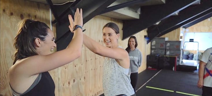 lizzie fisher owner of crossfit 2012 and a client | Photo Credit: CrossFit 2012