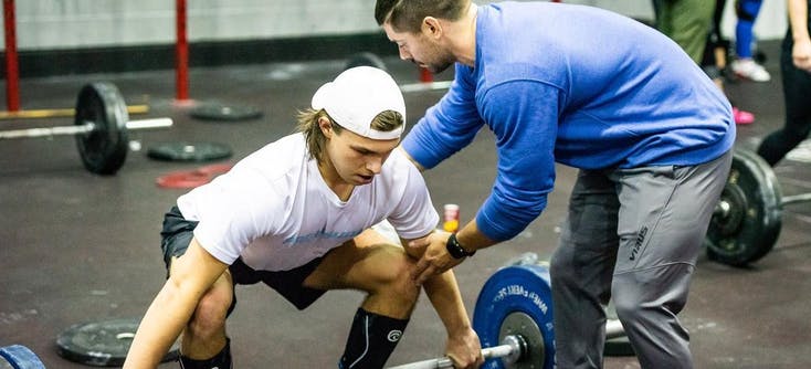 colchester fitness centre crossfit coach teaching a client | Photo Credit: Colchester Fitness Centre