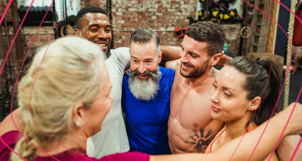 Happy members celebrating each other at the gym