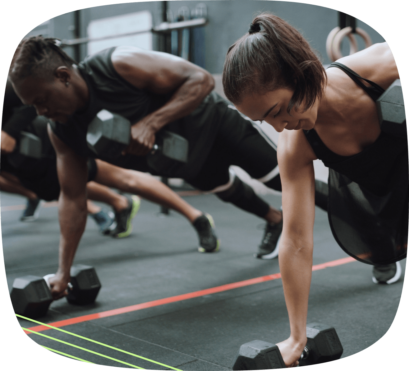 People lifting weights in a CrossFit gym