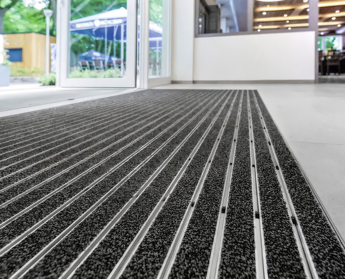 Entrance flooring with performance inserts