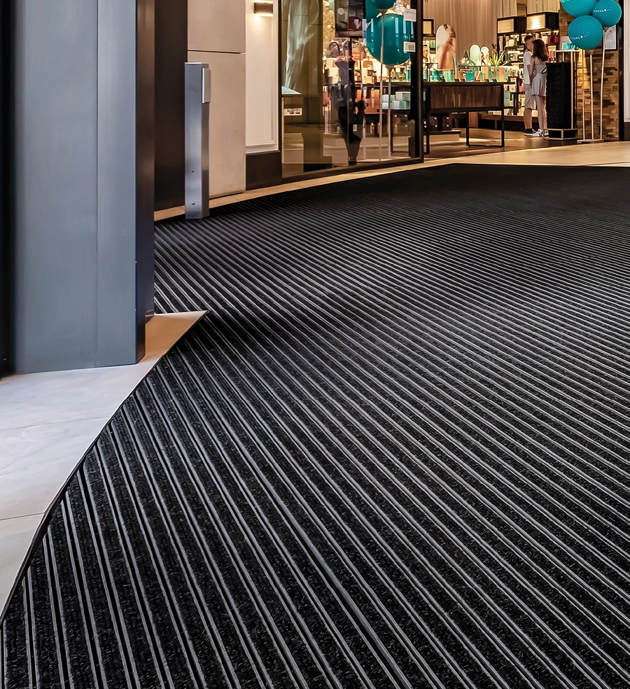 Entrance flooring system with textile inserts