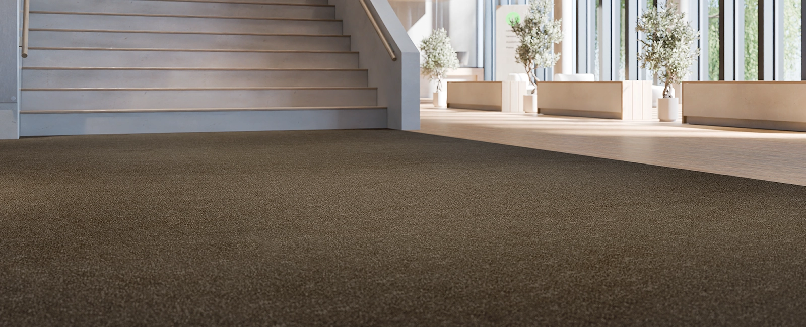 EMCO walk-off carpet in a bright entrance foyer with staircase