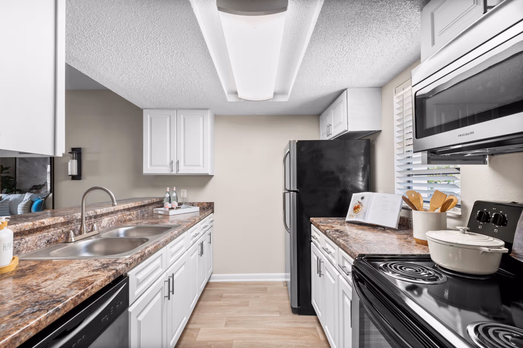 Kitchen with white cabinets and stainless steel appliances