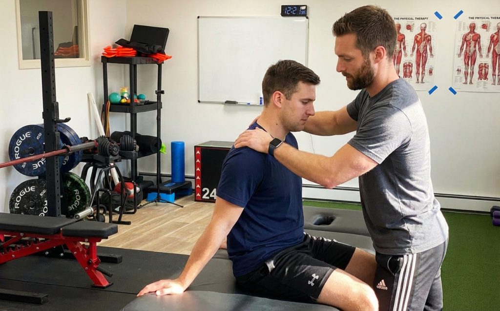 Patient working with a provider at a performance physical therapy clinic in Hackensack