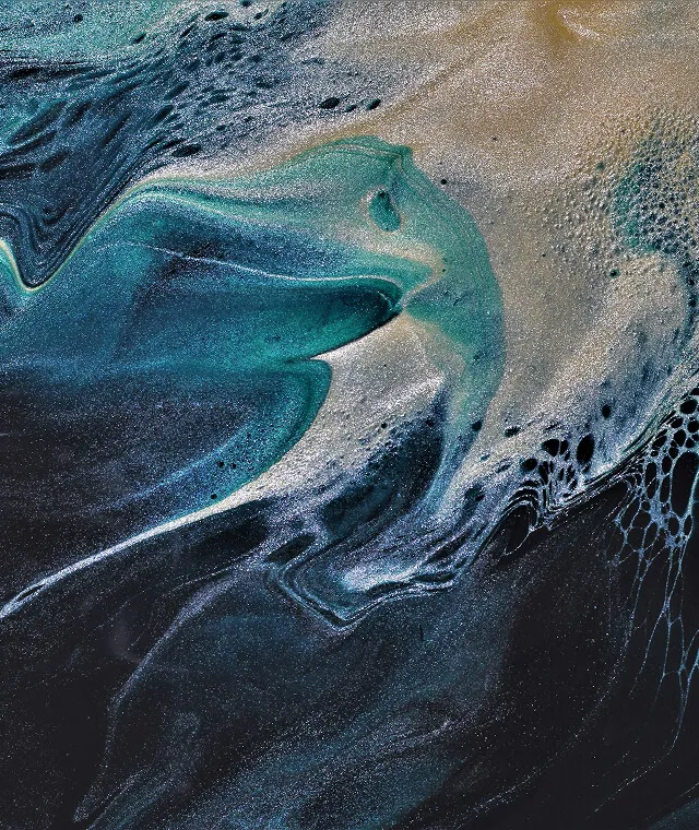 Abstract swirling pattern in teal, black, and gold with bubbly and textured areas.