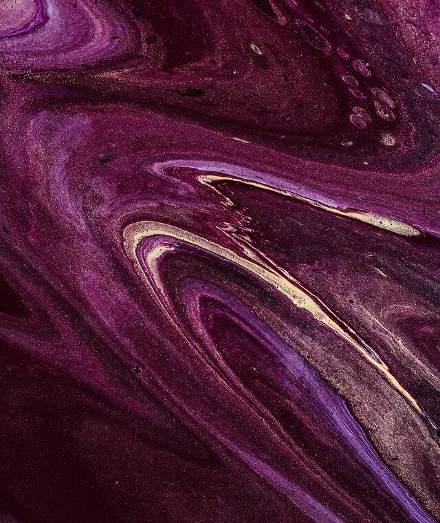 Abstract swirling pattern in shades of purple, violet, and gold with glittery texture.