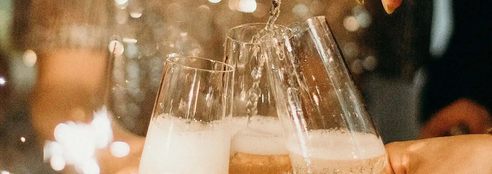 cheersing champagne glasses in holland michigan
