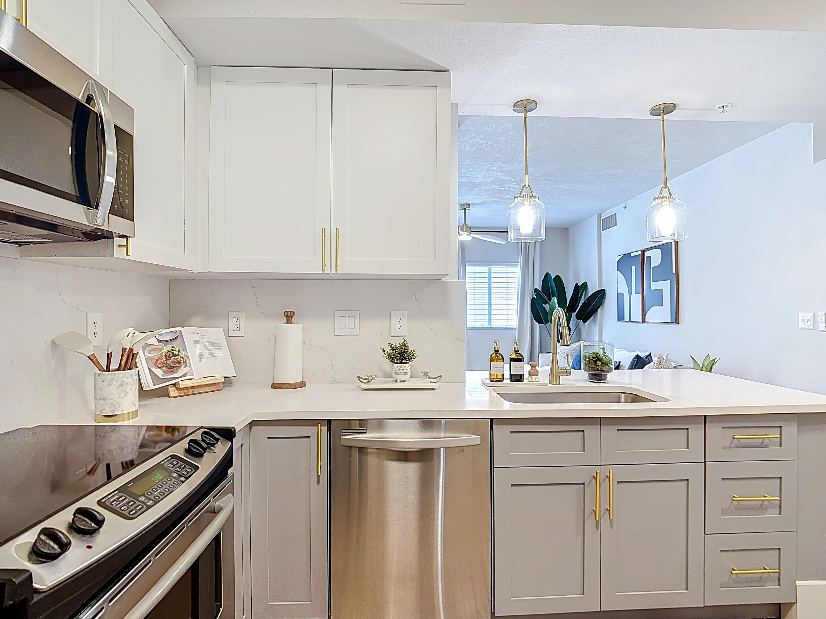 Dining area with table chairs and view of kitchen with breakfast bar