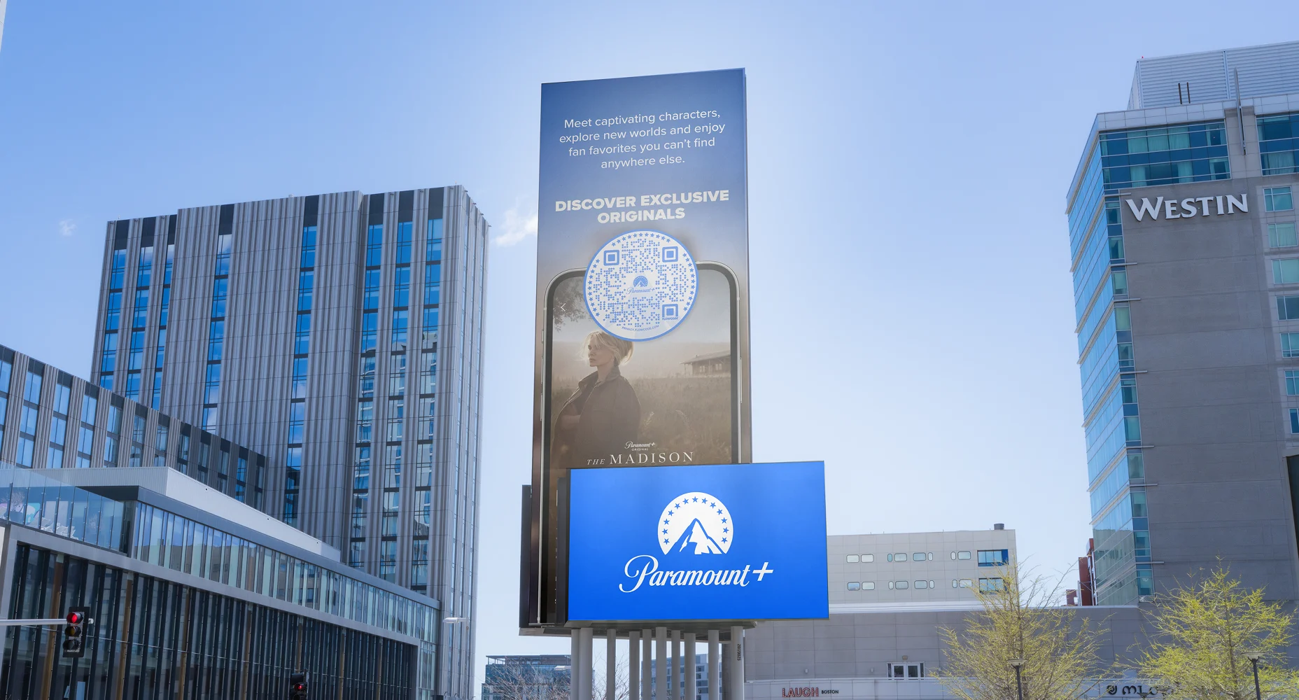 Outdoor Paramount+ advertisement with Flowcode promoting exclusive originals and a show called The Madison.