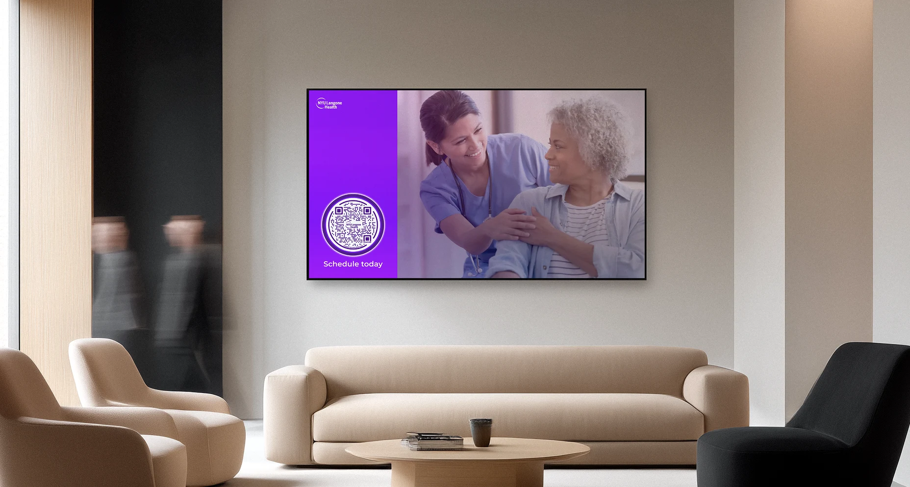 Waiting room with beige and black chairs, beige sofa, and screen showing nurse with elderly woman and a Flowcode.