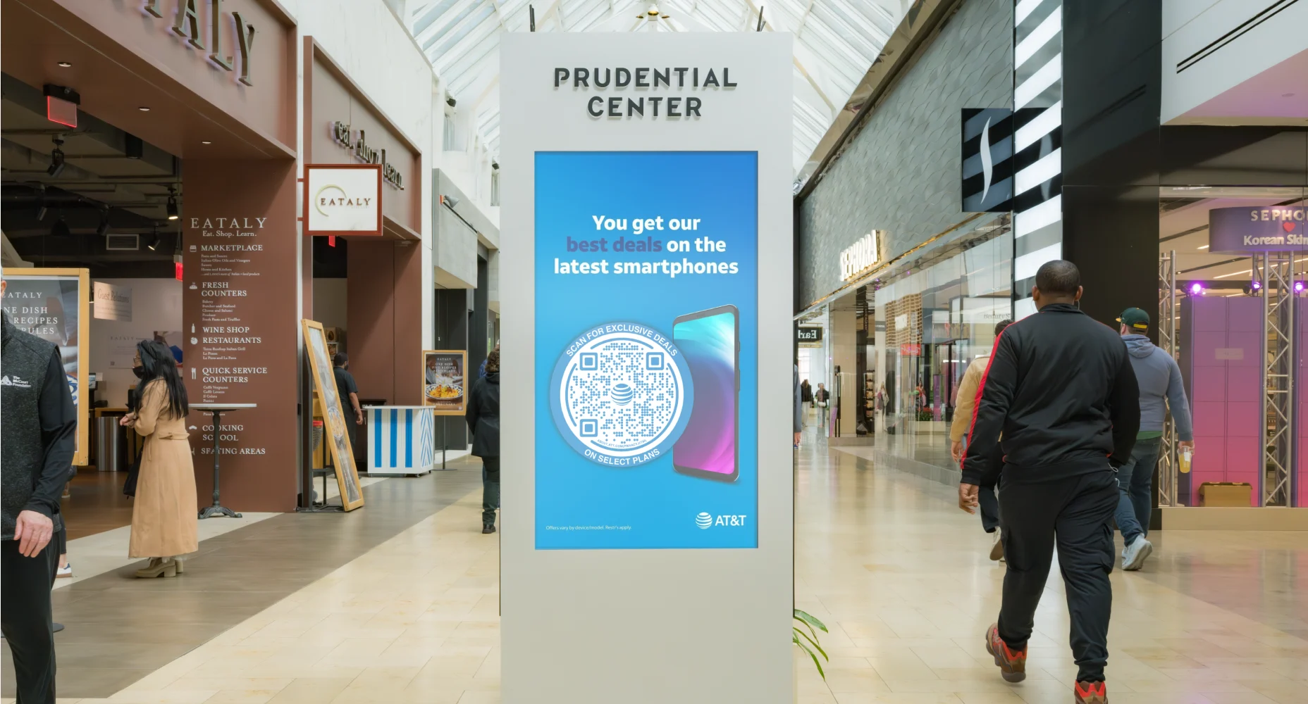 Prudential Center digital kiosk advertising AT&T smartphone deals with a Flowcode in a shopping mall.