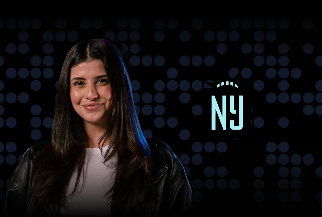 Joudy Nadri next to the Gotham FC Logo against a dark background with gradient blue dots.