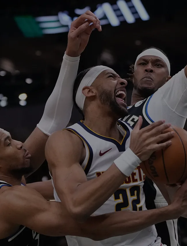 Milwaukee Bucks defender contests a drive during an NBA game at Fiserv Forum