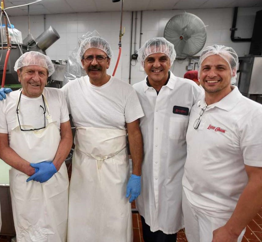 Lino Liuzzi, Nicola Liuzzi, Carmine Durante, Ralph Liuzzi standing in the production room,