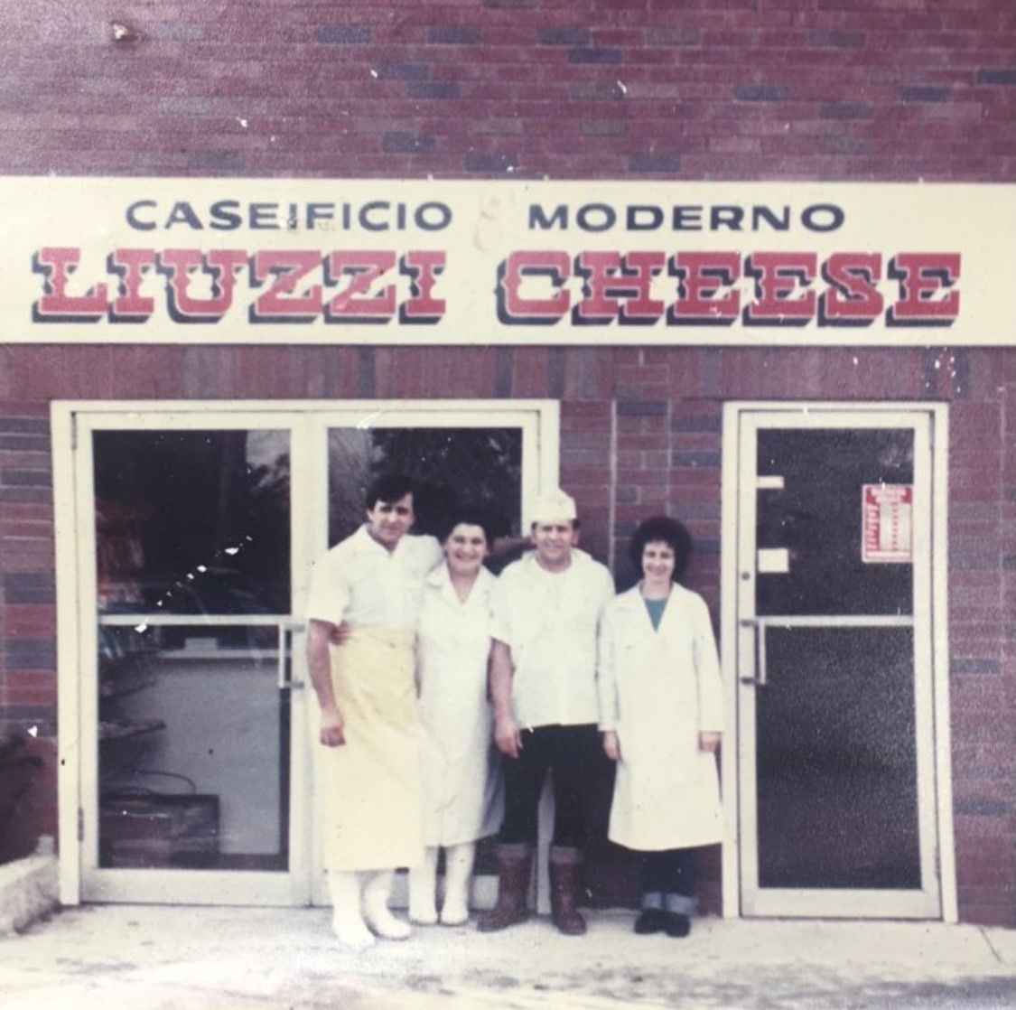 The Liuzzi Family standing outside the original storefront in 1981.