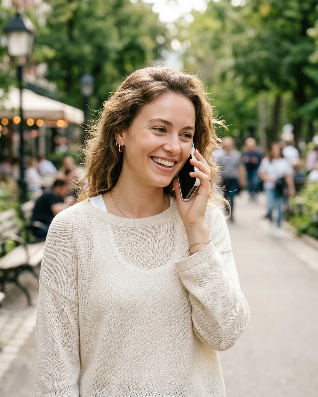 Woman smiling on a phone call about her insurance quote with Tungsten Insurance