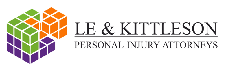 Le & Kittleson logo with black wording and 3D cube