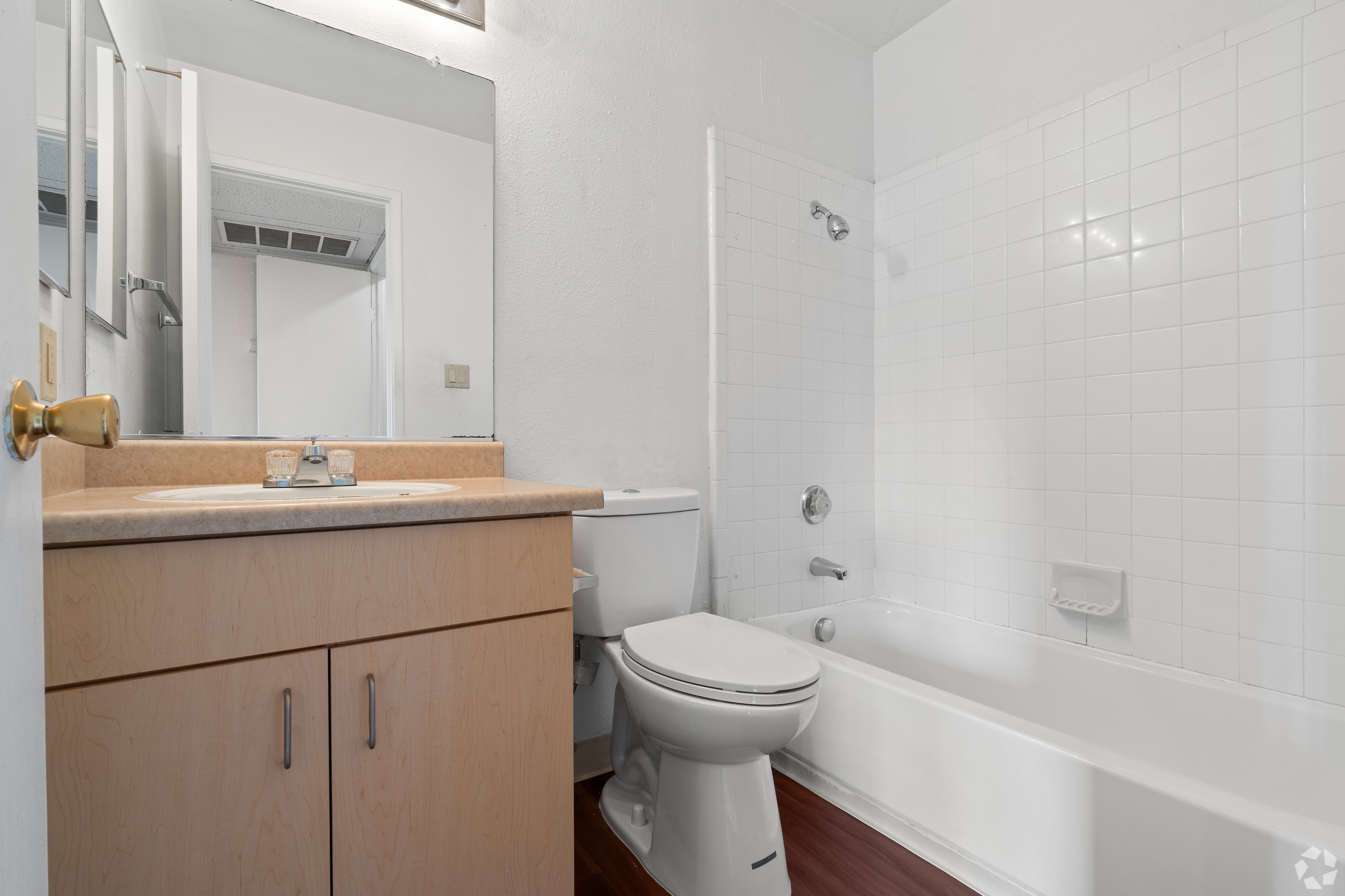 Bathroom with brown cabinets 