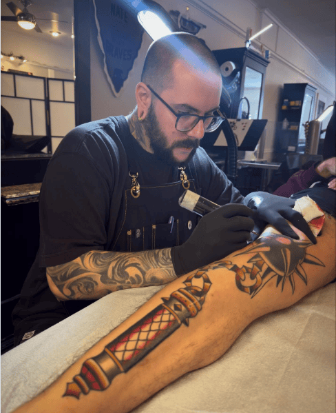 image of tattoo artist at work