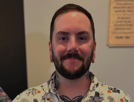 [headshot] image of satisfied student using a laptop