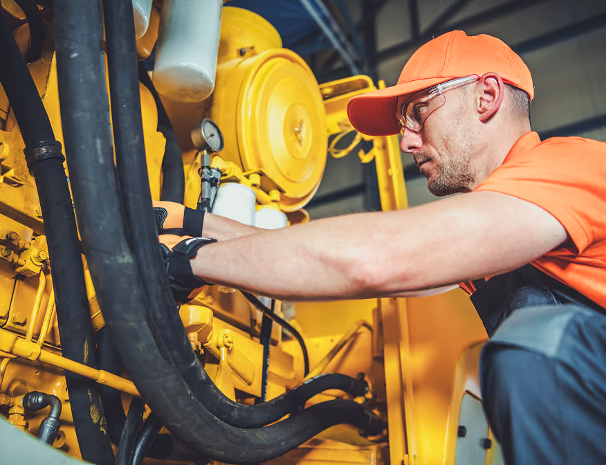 Technician performing maintenance and mechanical repair at an industrial maintenance jobs.