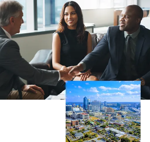 Investors shaking hands in an office and a shot of downtown Jacksonville sitting on top of that image
