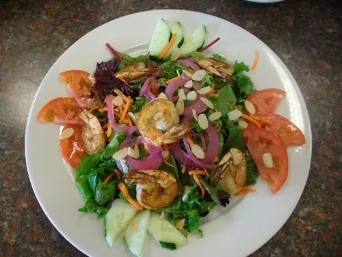 shrimp salad served on a plate