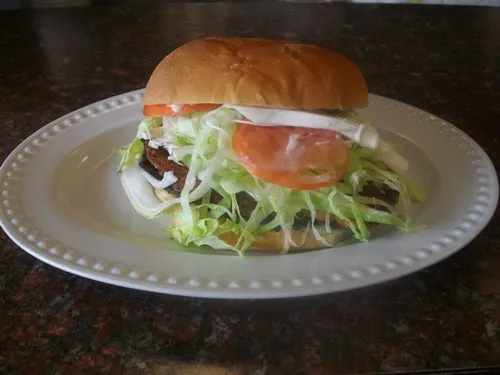 a breaded steak torta on a plate.