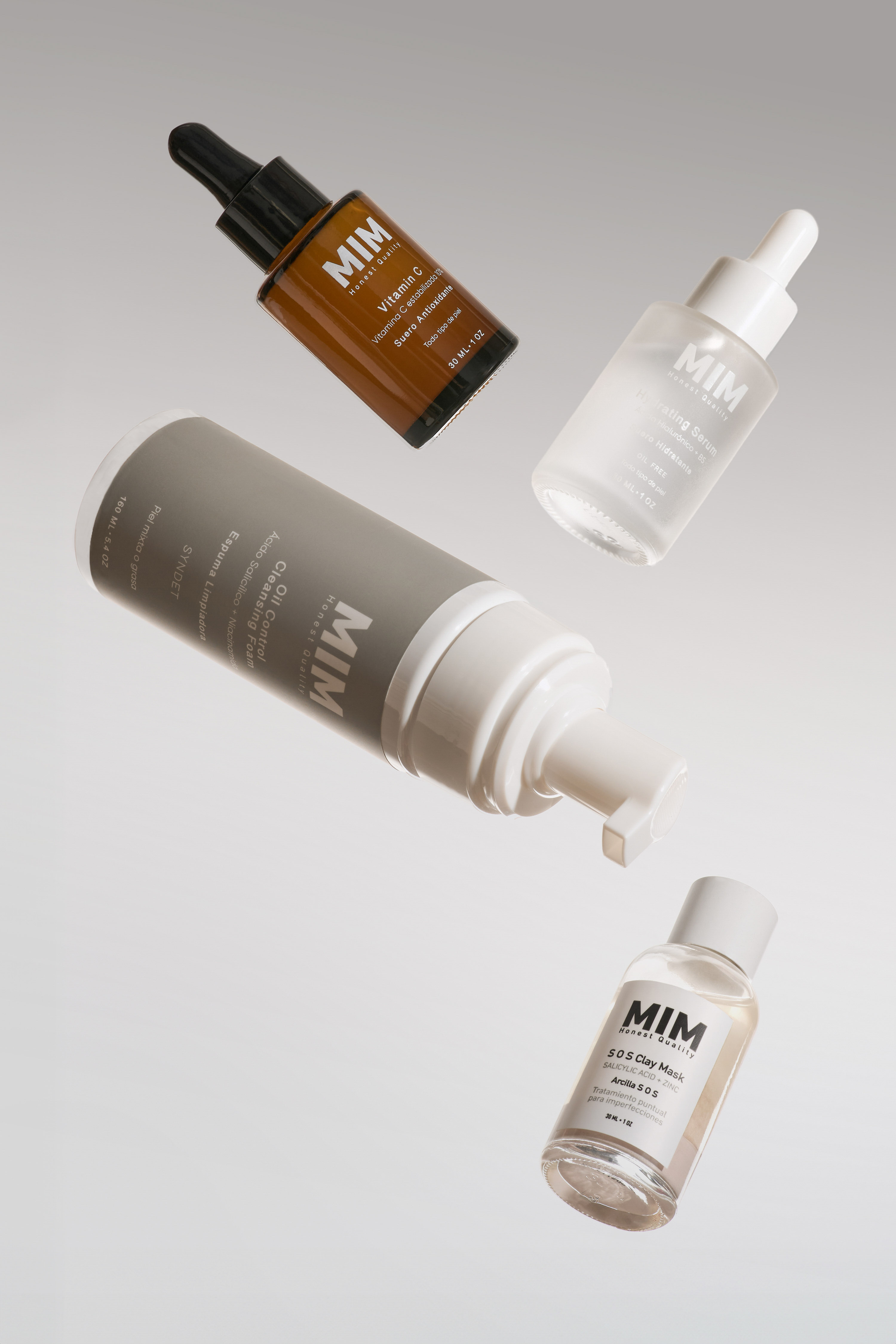 Skincare product photography by Gooper: MIM vitamin C serum, cleansing foam and clay mask captured in a floating flat-lay composition.