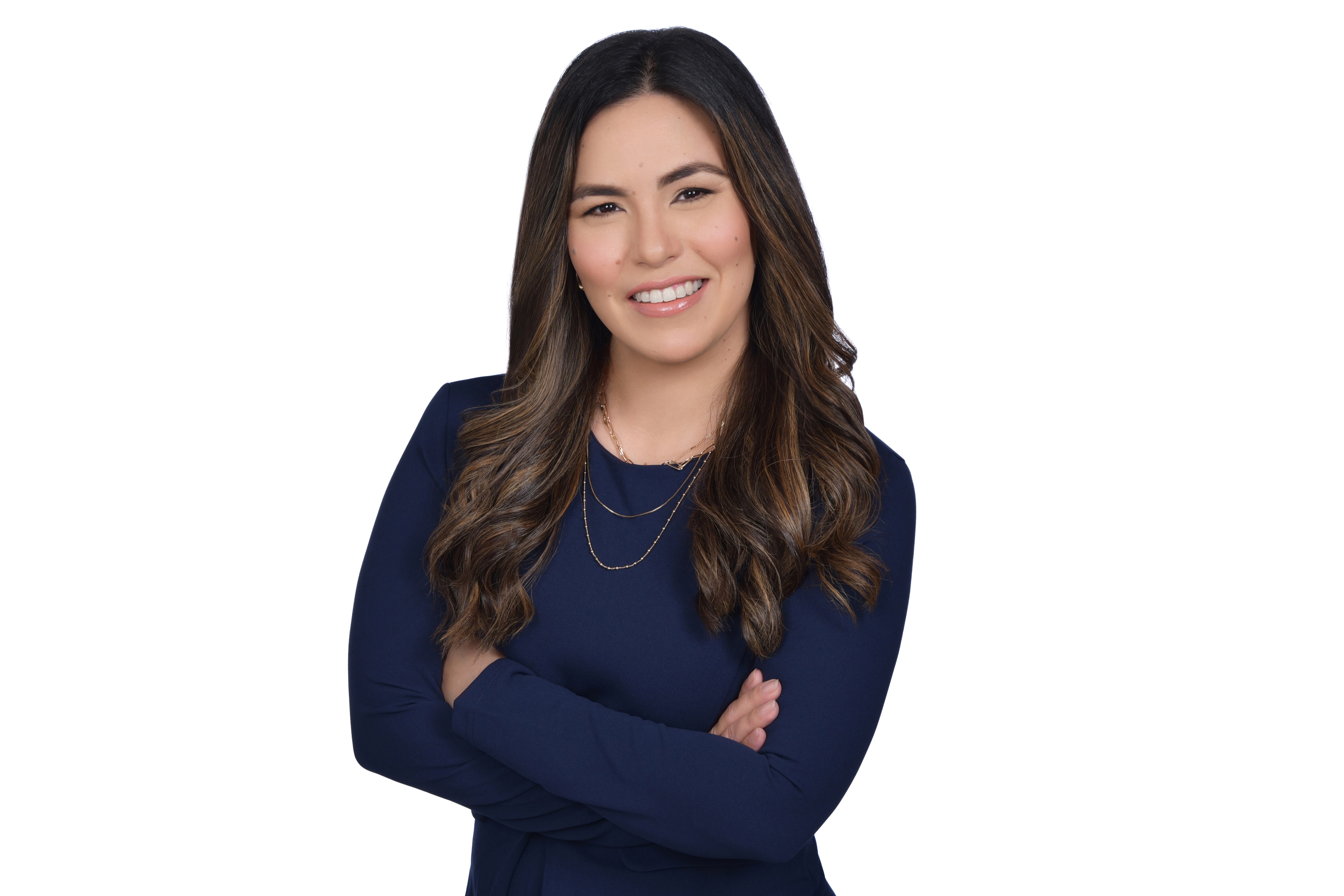 Attorney Mirene Mairena, family law attorney in Coral Gables Florida, standing with arms crossed and smiling