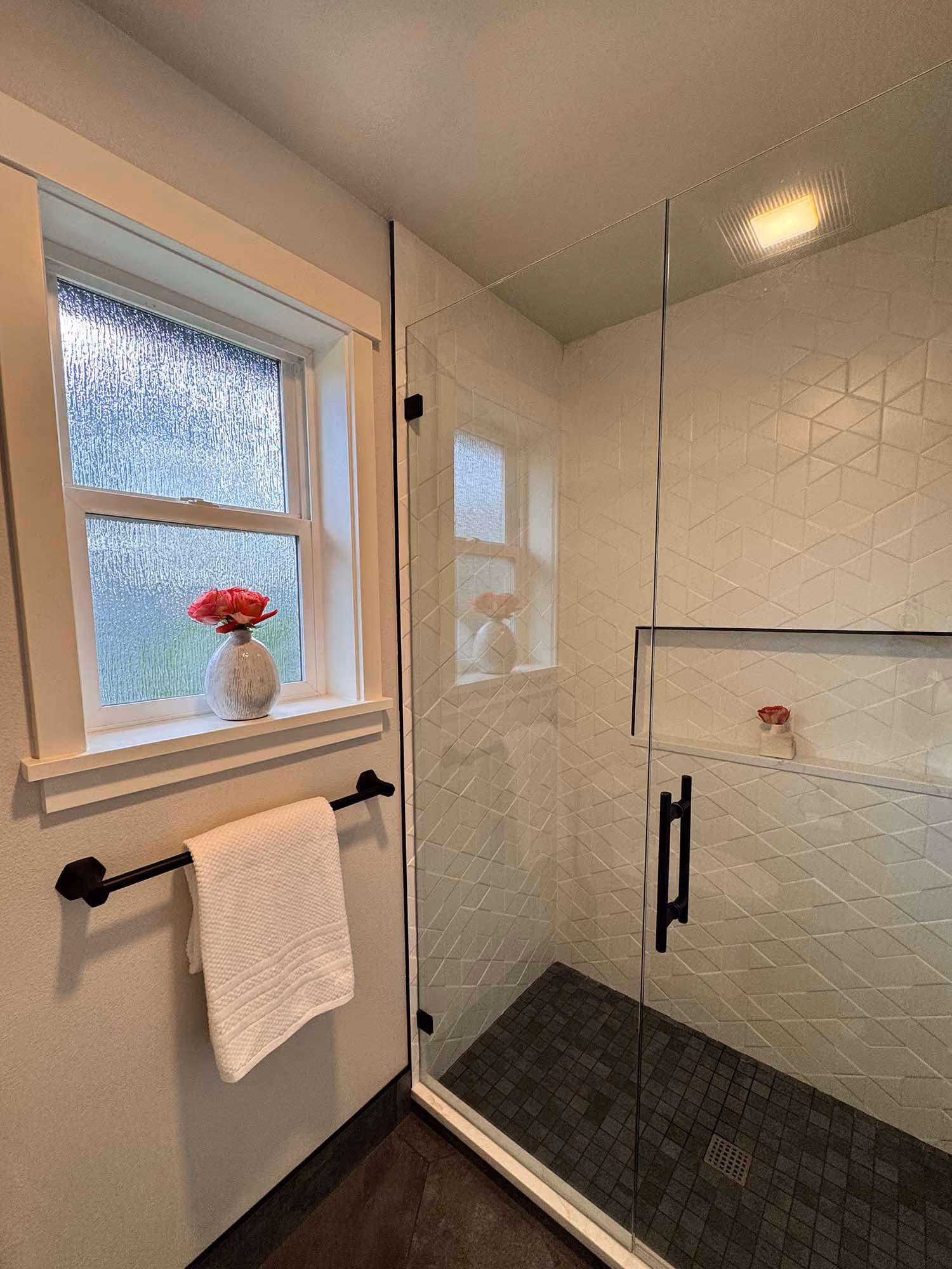 Bathroom with vanity and glass shower enclosure