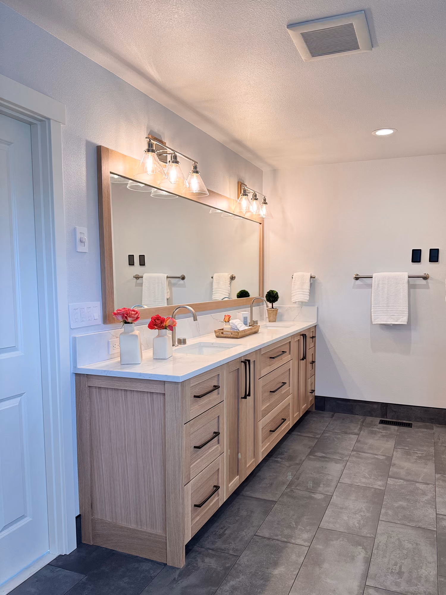 Double-sink bathroom vanity with mirrors and lights