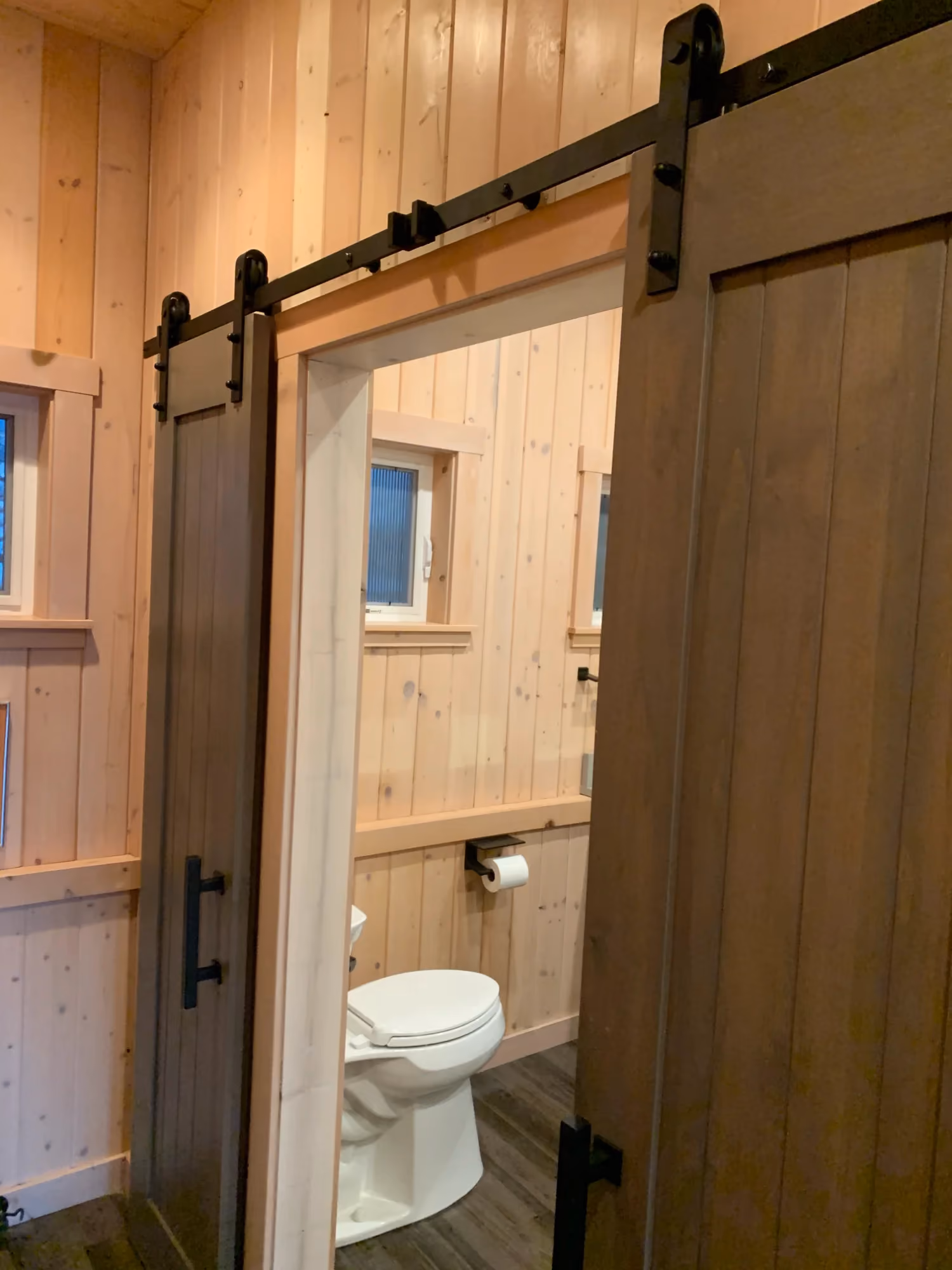 Barn-style sliding door opening to a bathroom vanity