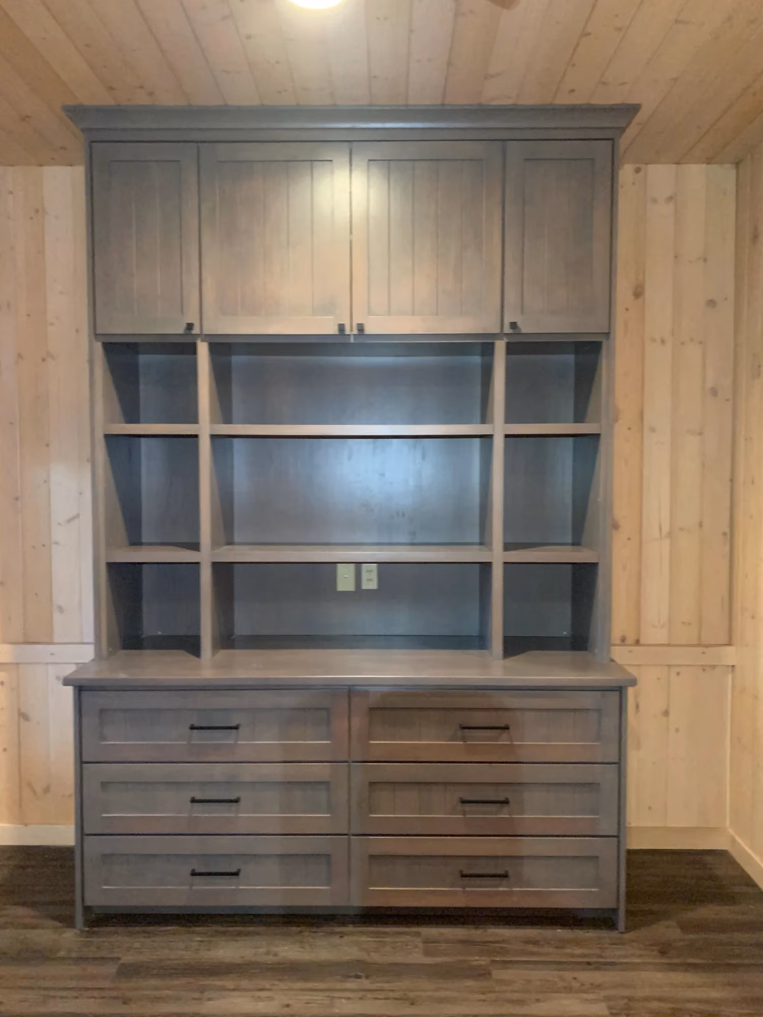 Built-in wooden cabinet with glass doors and drawers