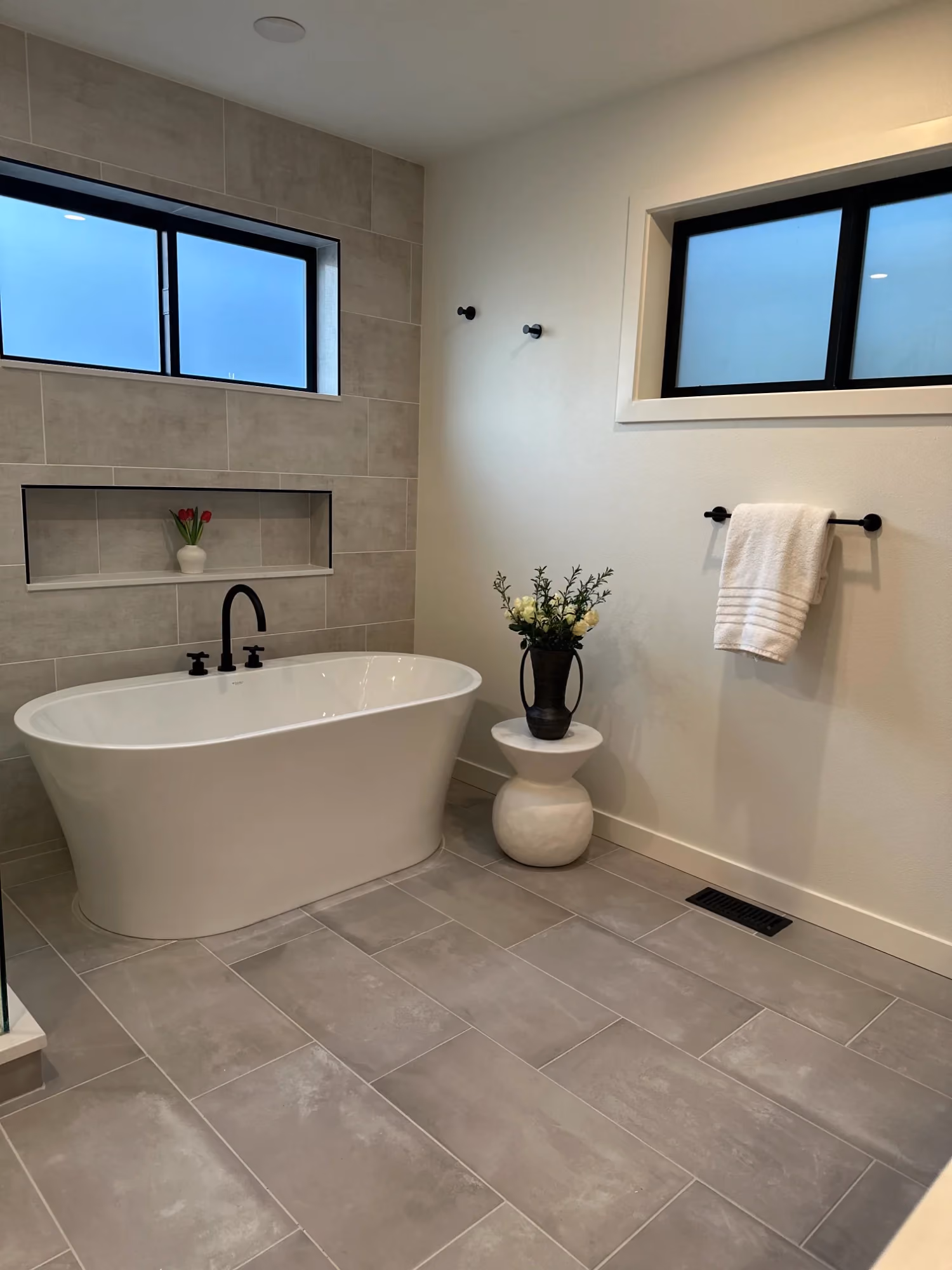 Bathroom with soaking tub and tiled floor