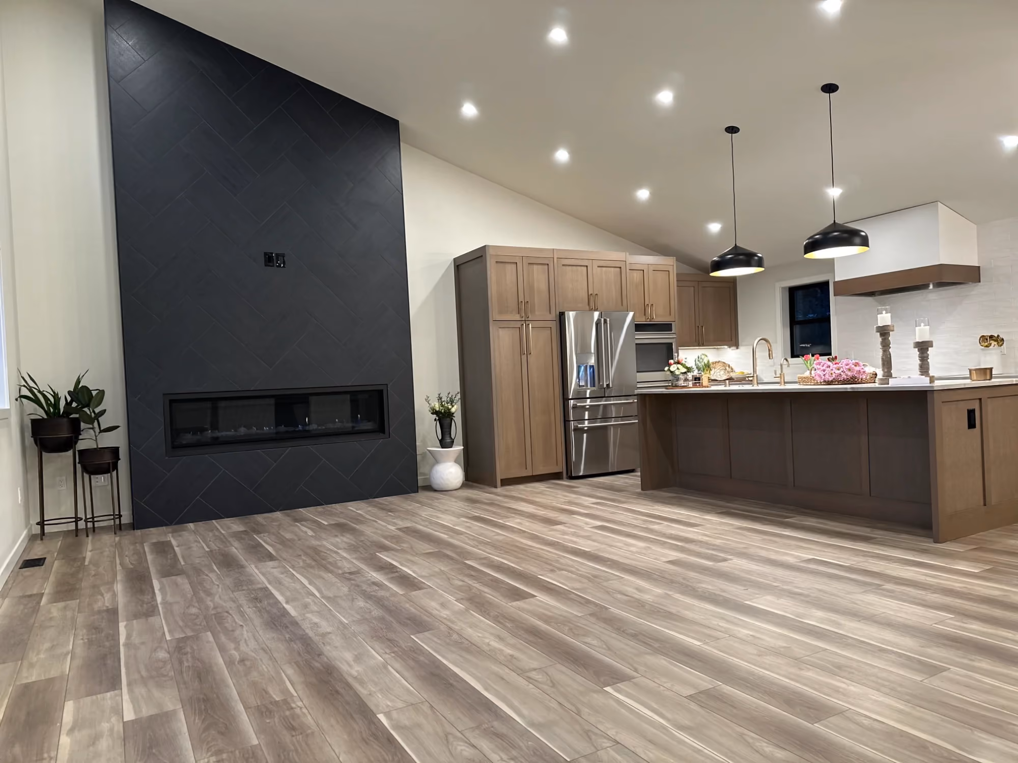 Modern open-plan kitchen with wood flooring