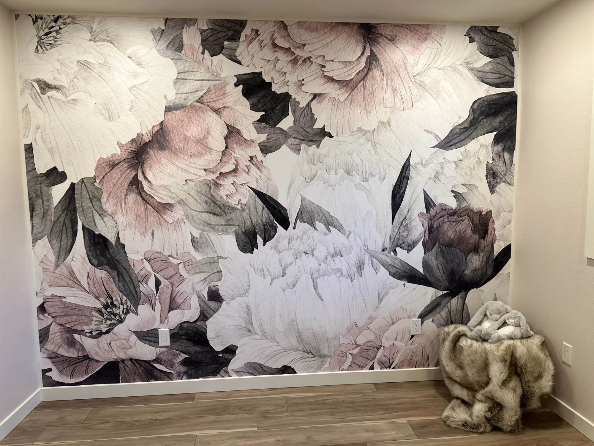 Floral mural wall with decor on console table