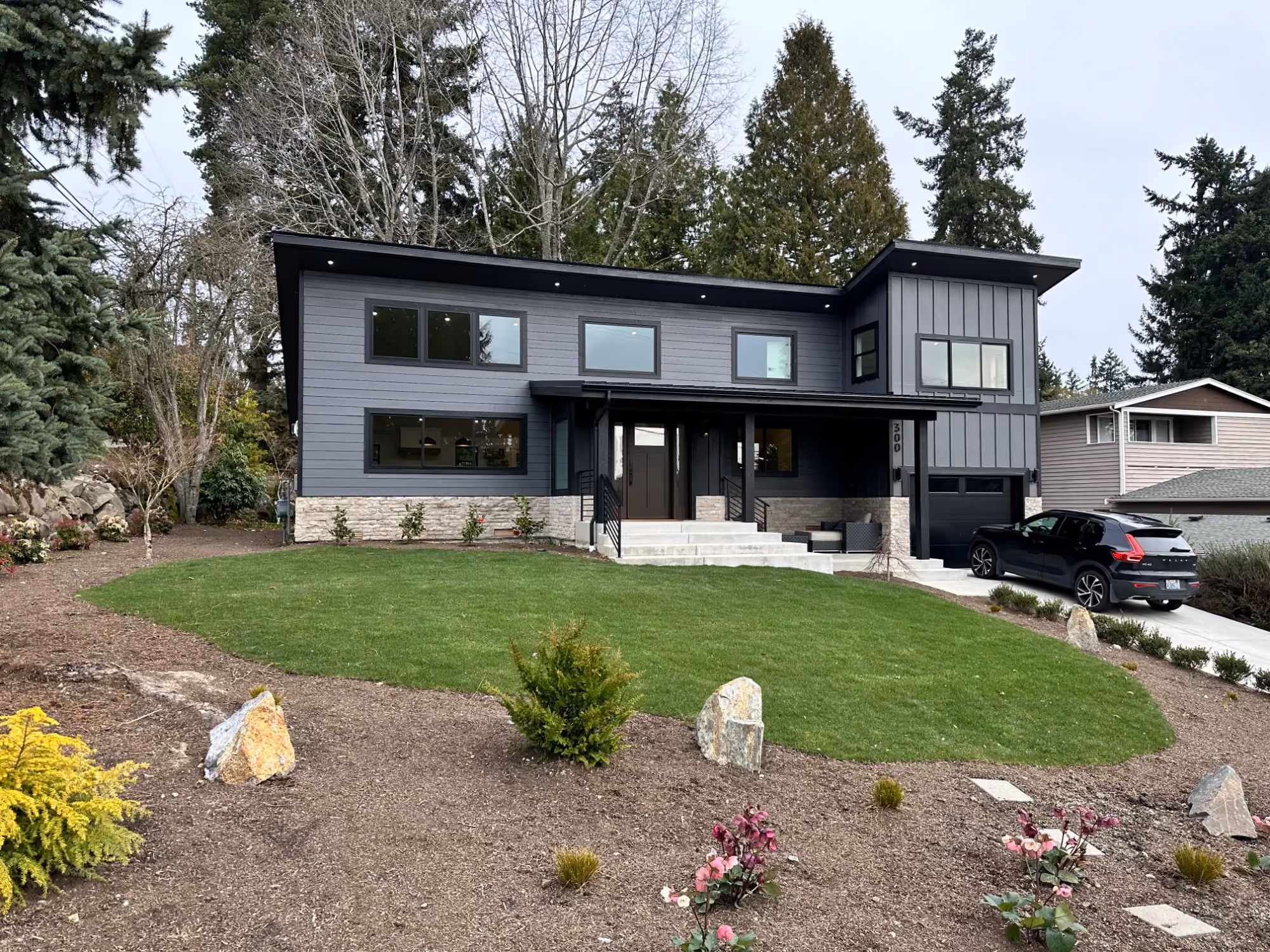 Modern two-story home exterior with landscaped yard