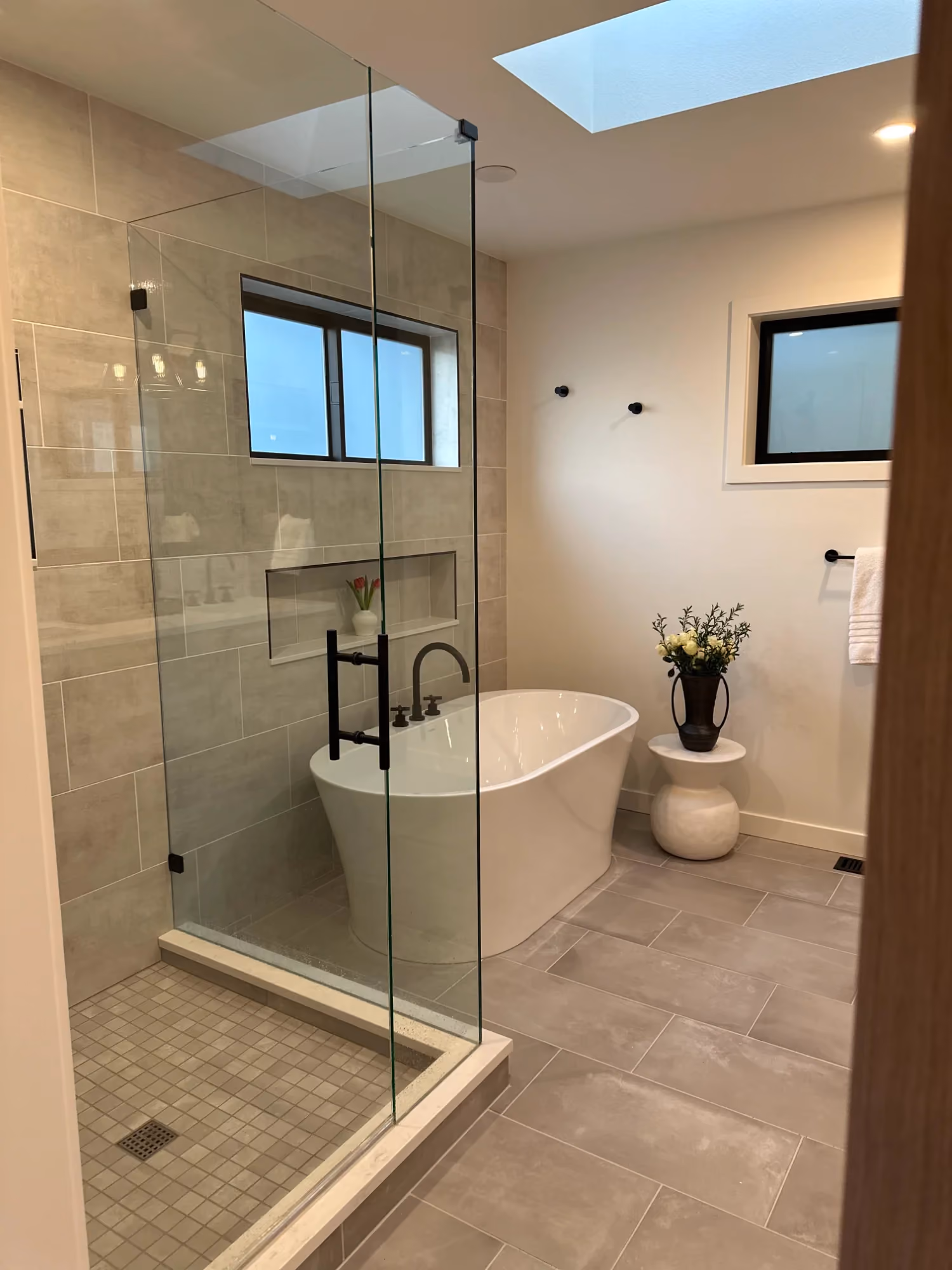Bathroom with walk-in shower, toilet, and vanity